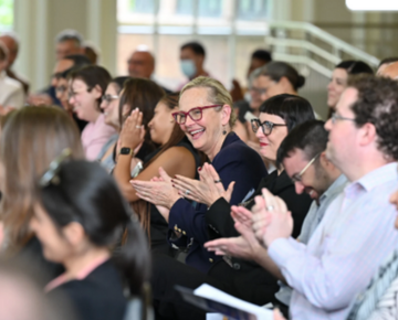 Group of people smiling and applauding