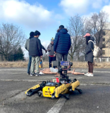 autonomous robot with researchers looking at dummy patient in the background
