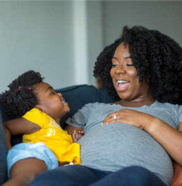 pregnant woman with her child