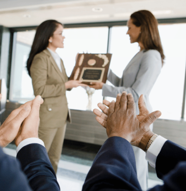 woman being presented with an award