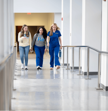 nursing students walking down hall