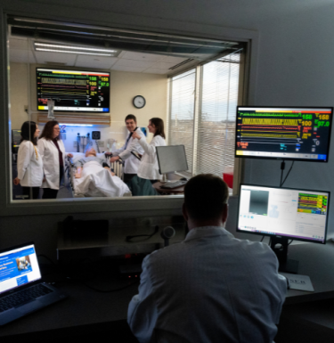 people practicing on fake patient