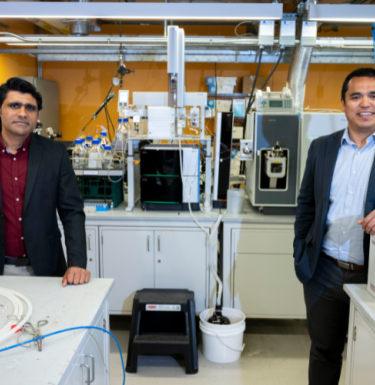 researchers standing in lab