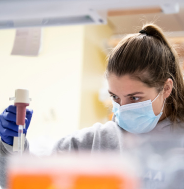 researcher using pipette