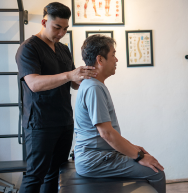 chiropractor adjusting patient
