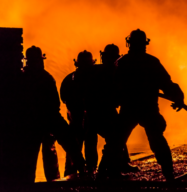 firefighters in front of fire