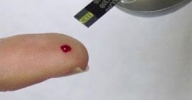 close up of a pricked finger for a blood test